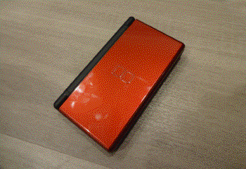 Top of red DS Lite. Has some fingerprints.